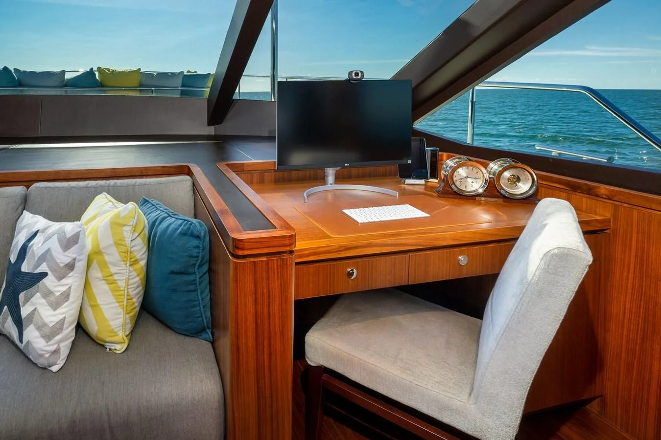 a desk with a laptop and a chair aboard SEA N SEA Yacht for Sale