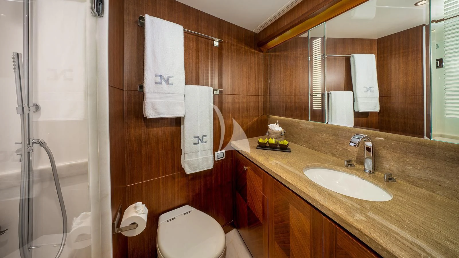 a bathroom with a sink toilet and towels aboard SEA N SEA Yacht for Sale