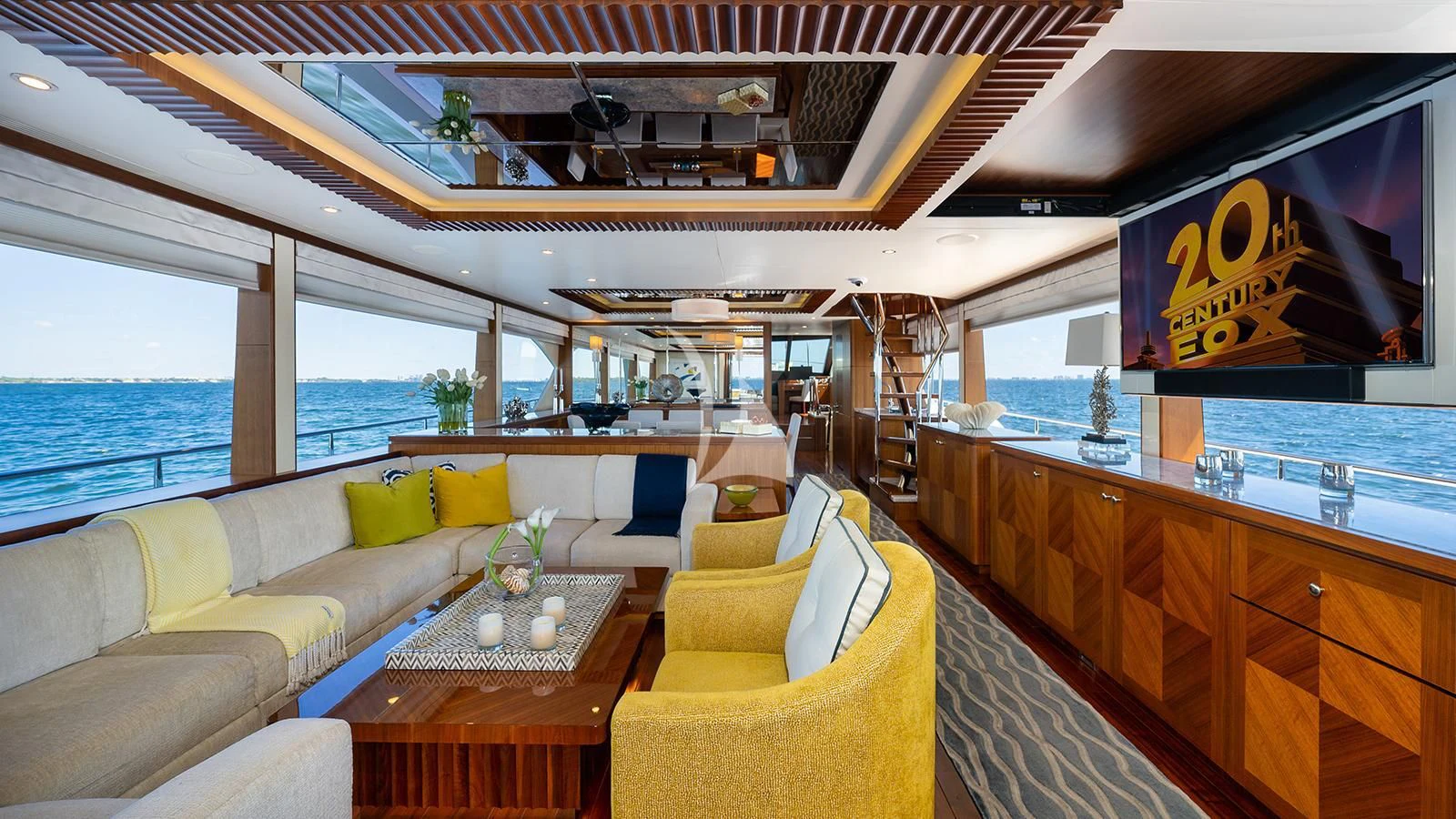 a room with a couch and a table and a window aboard SEA N SEA Yacht for Sale