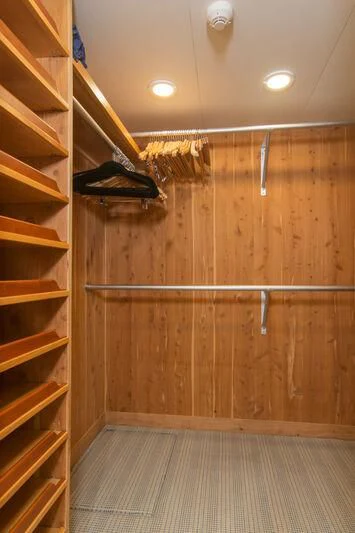 a wooden room with a wood wall and a shelf with a wood wall aboard ADVENTURER Yacht for Sale