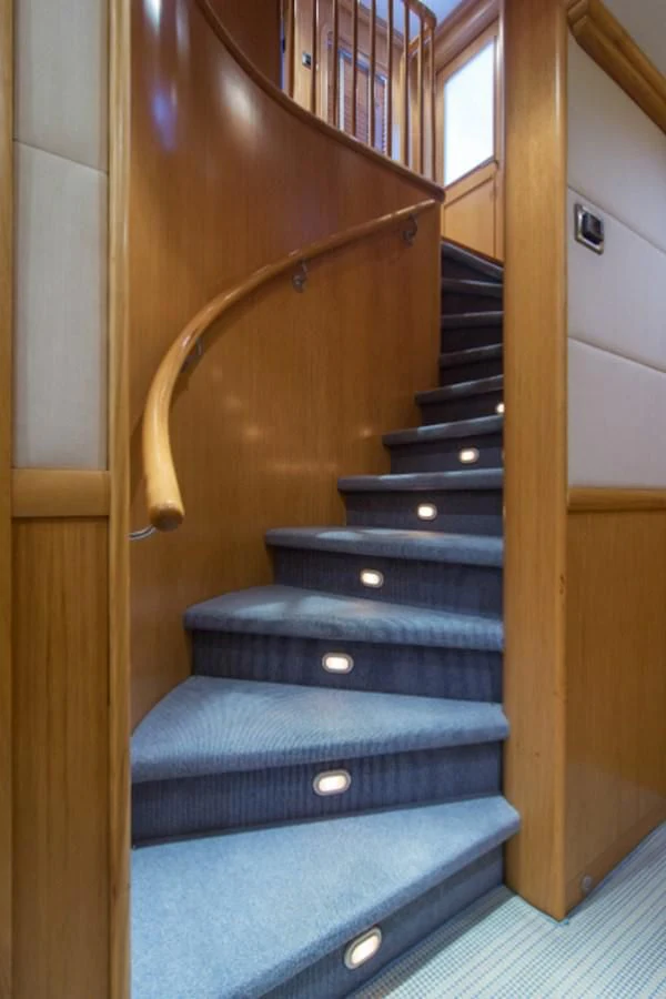 a set of stairs in a house aboard ADVENTURER Yacht for Sale