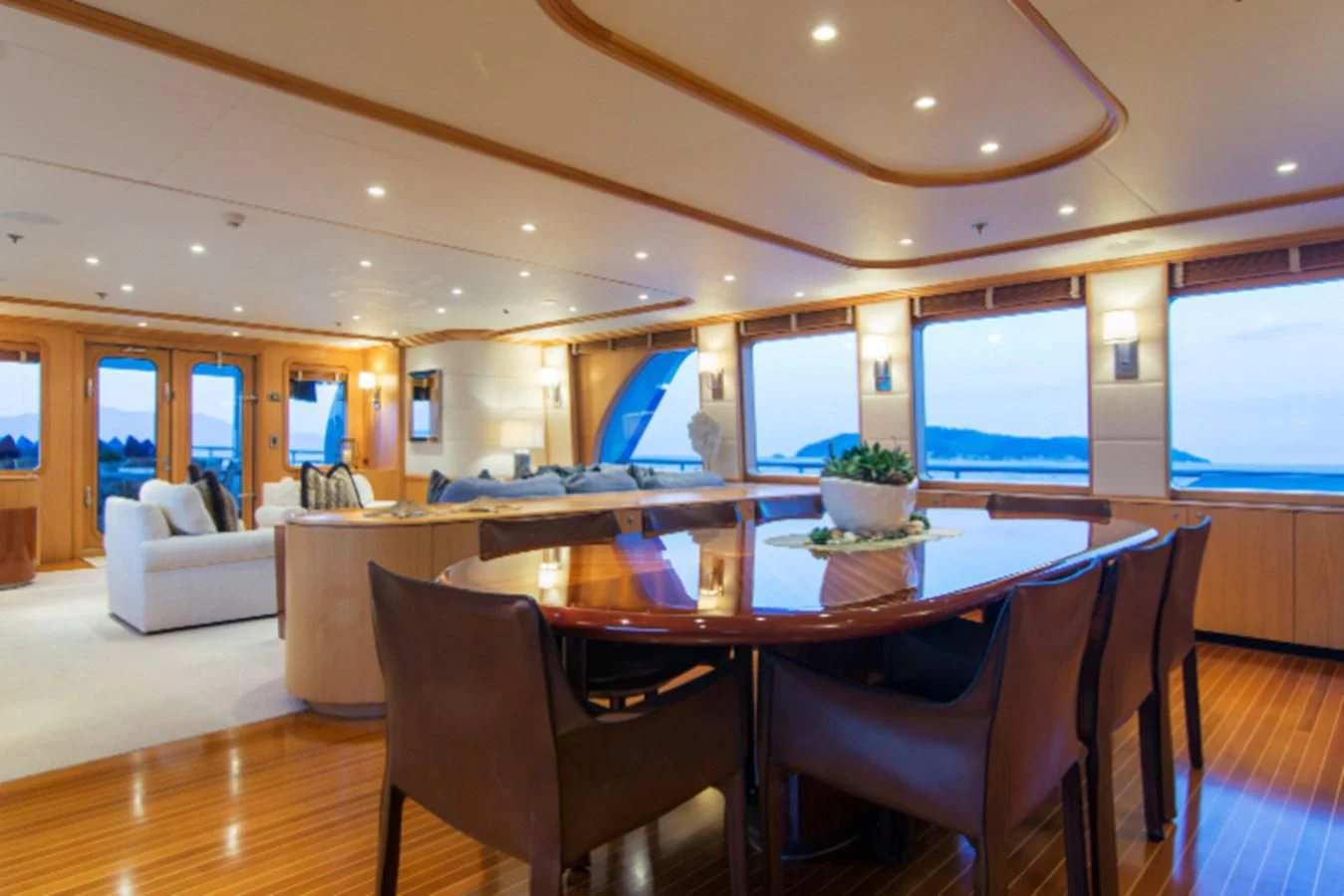 a large dining room with a large table and chairs aboard ADVENTURER Yacht for Sale