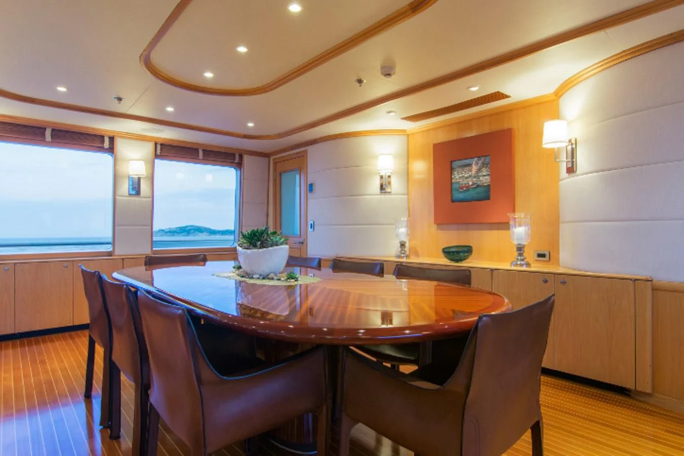 a dining room with a table and chairs aboard ADVENTURER Yacht for Sale