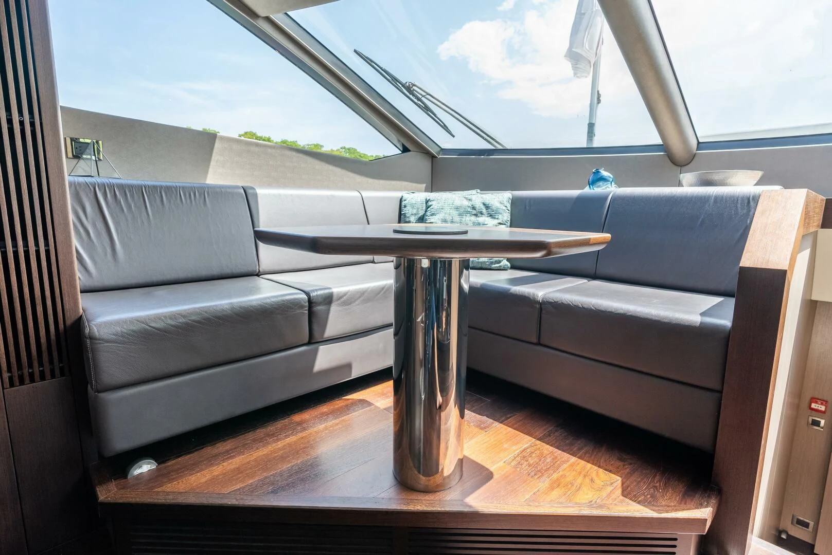a glass coffee table on a deck aboard F5 Yacht for Sale