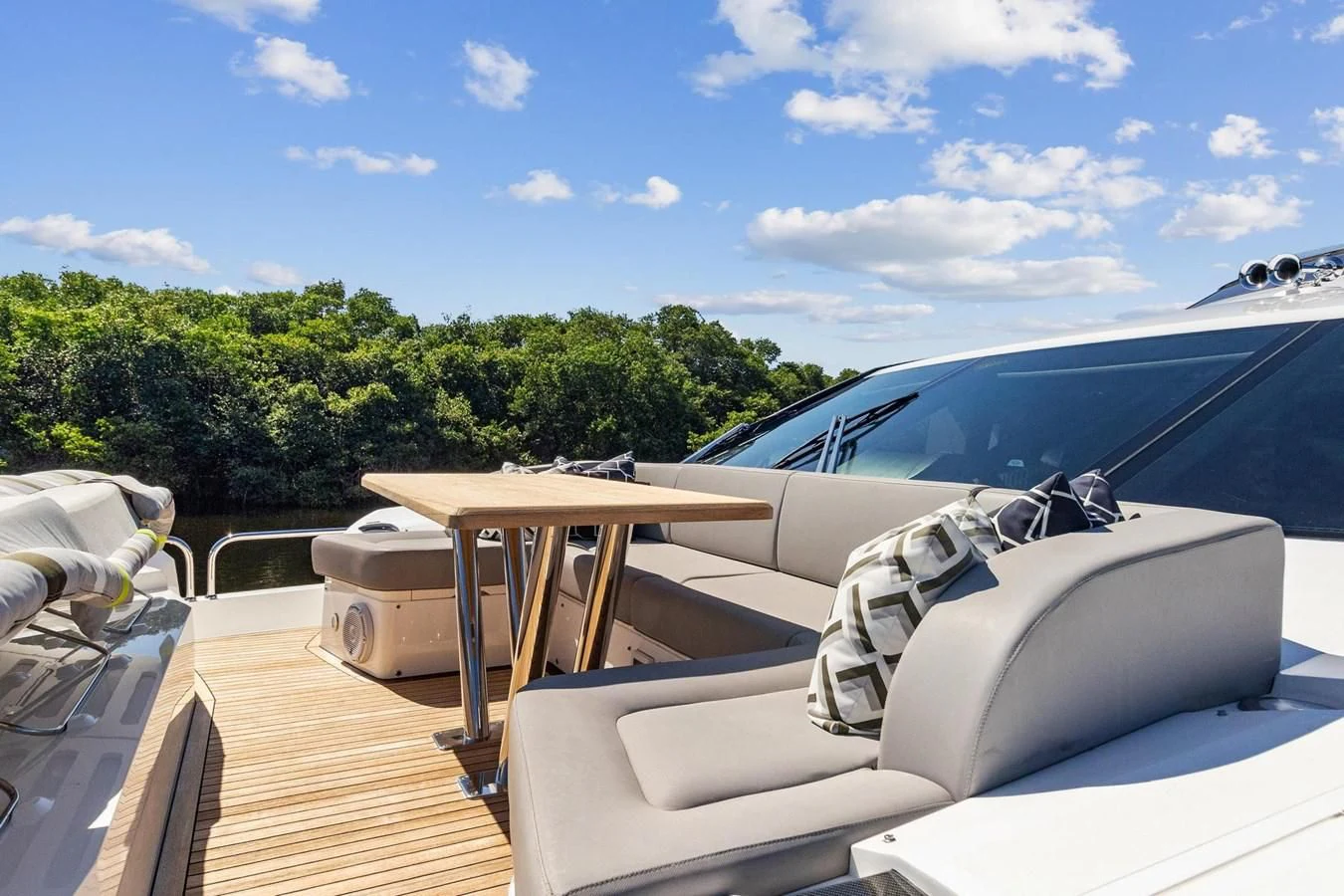 a luxury car on a deck aboard F5 Yacht for Sale