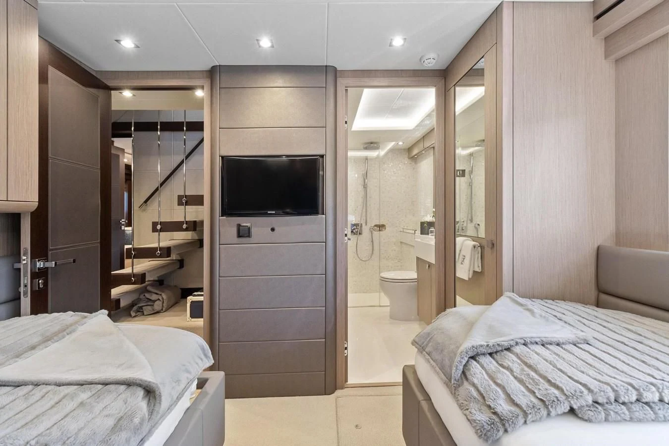 a bedroom with a bed and a television aboard F5 Yacht for Sale