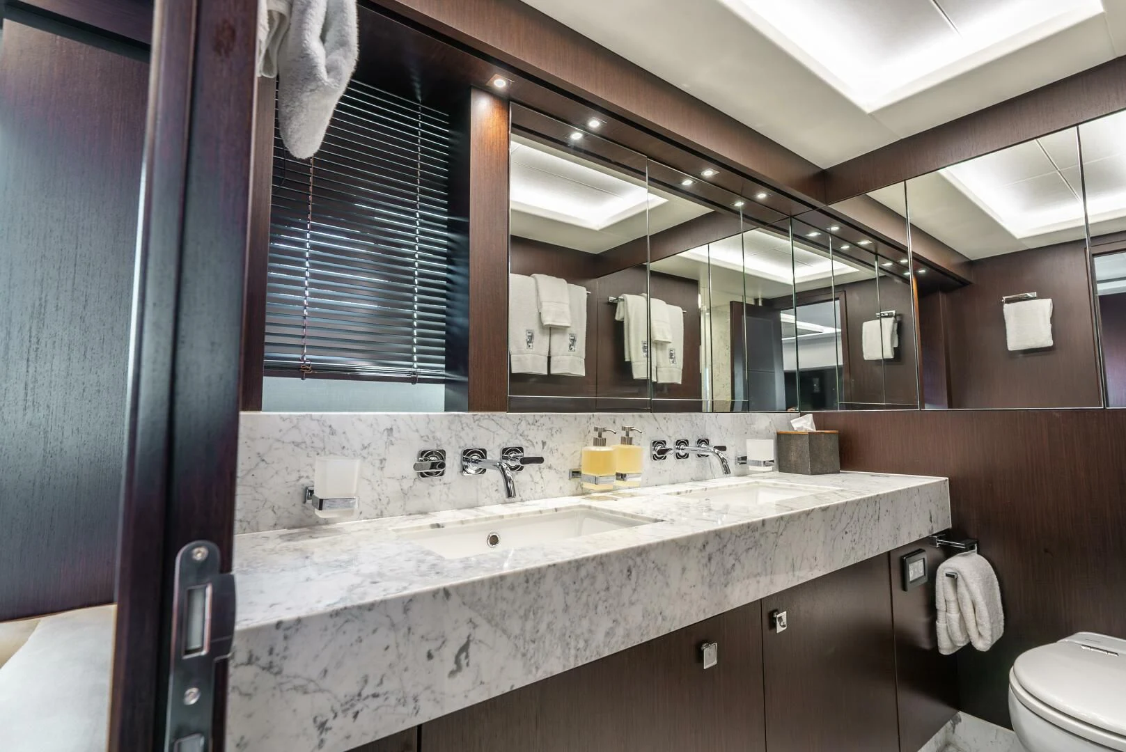a bathroom with a sink and a mirror aboard F5 Yacht for Sale