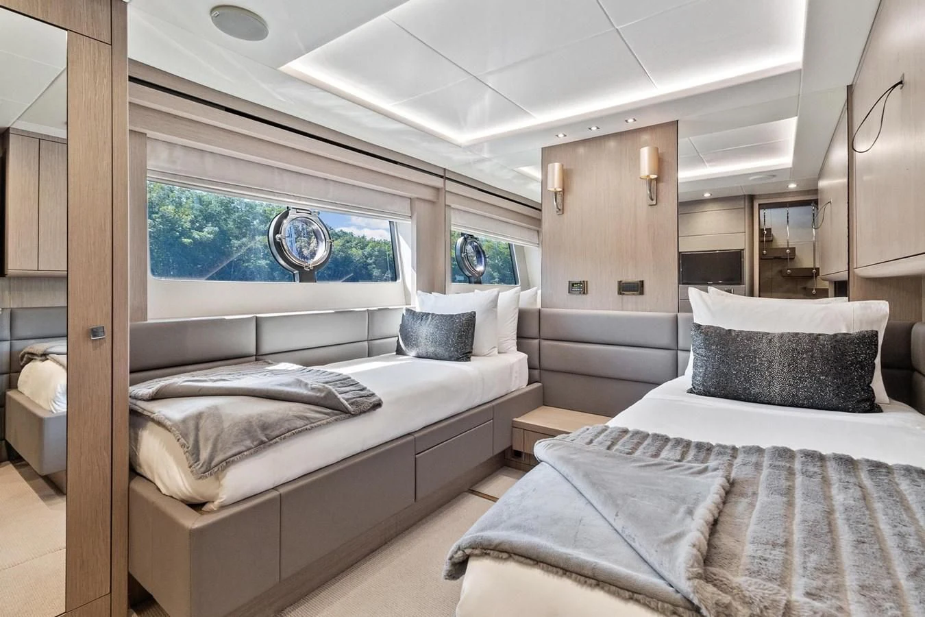 a room with two beds aboard F5 Yacht for Sale