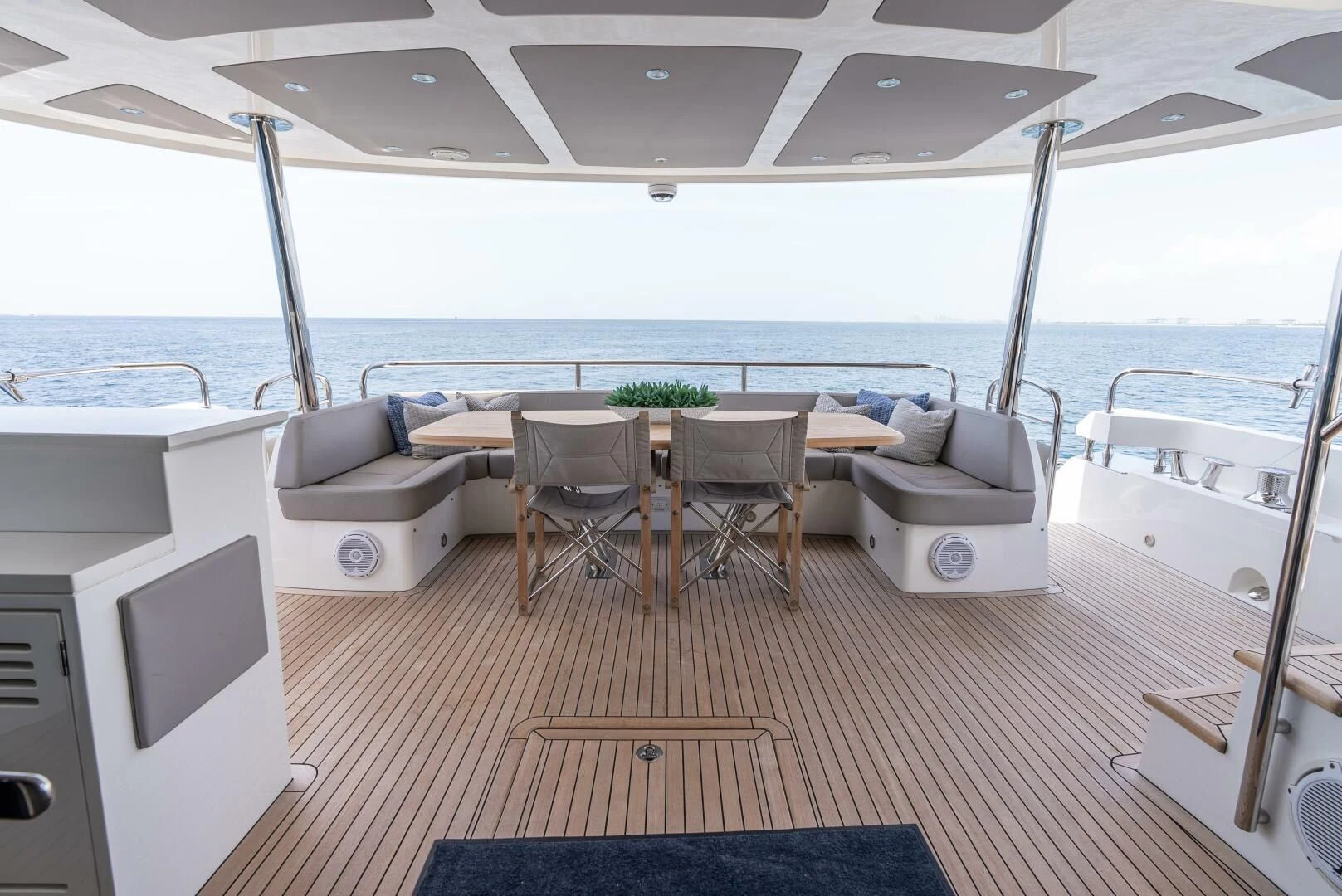 a boat with a table and chairs aboard F5 Yacht for Sale