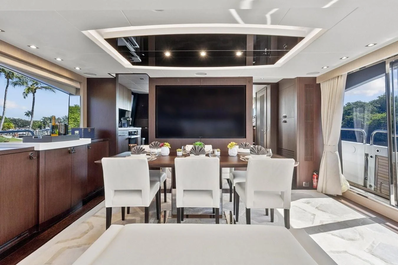 a large kitchen with a table and chairs aboard F5 Yacht for Sale