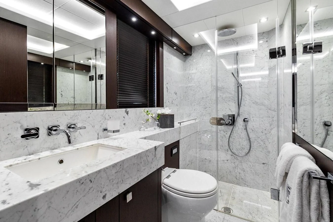 a bathroom with a sink toilet and bathtub aboard F5 Yacht for Sale