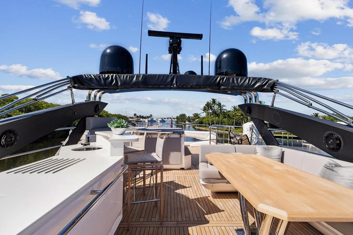 a deck with a large black ship on it and a large cannon on the deck aboard F5 Yacht for Sale