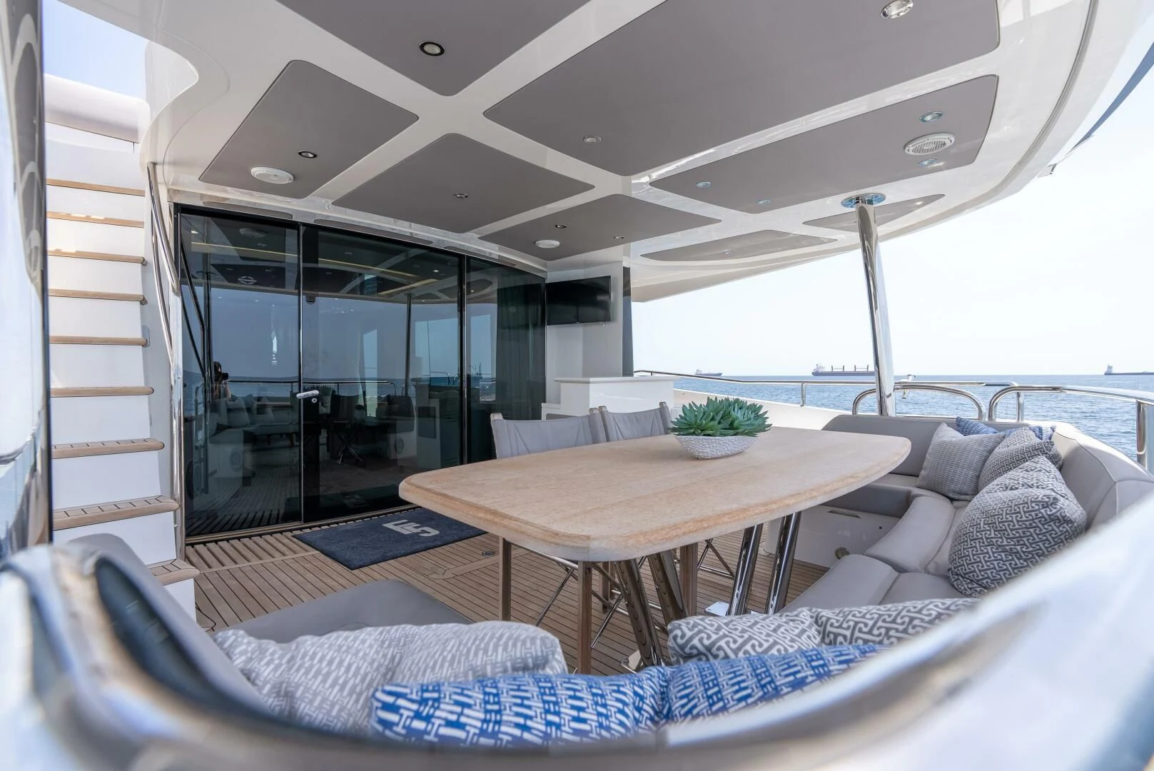a table and couch in a boat aboard F5 Yacht for Sale