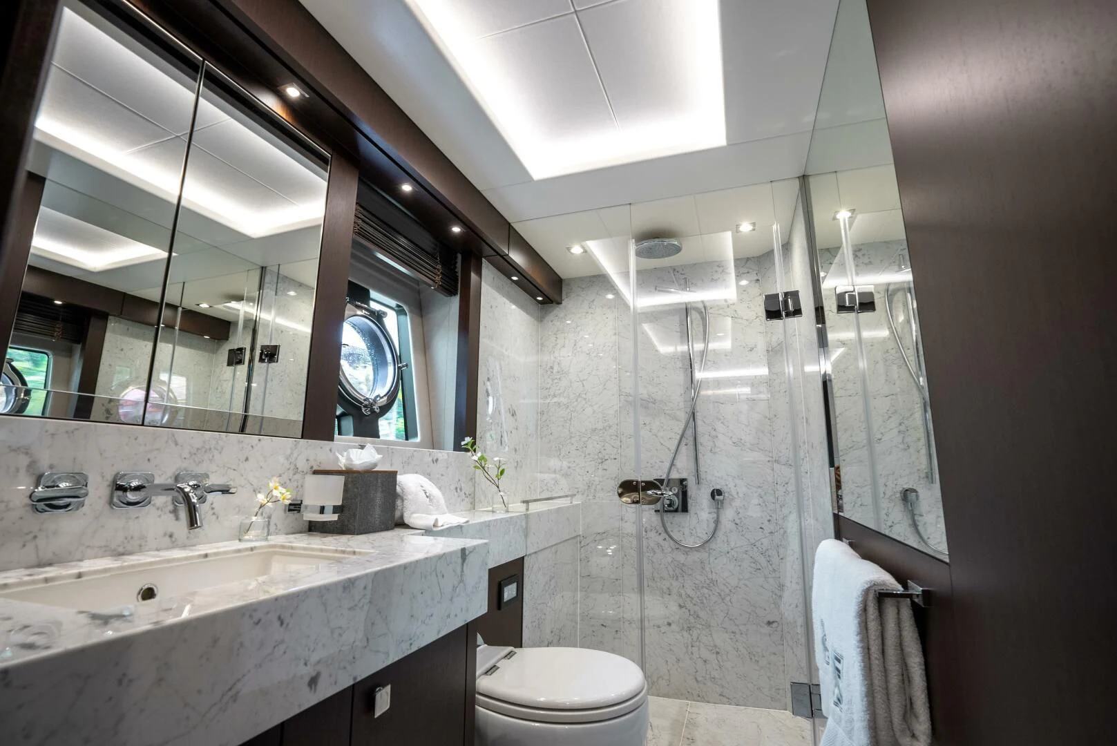 a bathroom with a sink and a mirror aboard F5 Yacht for Sale