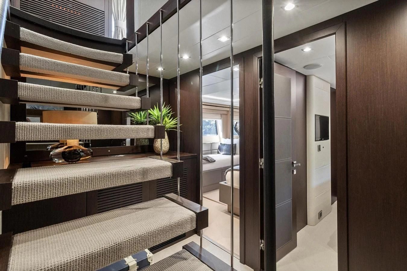 a room with a bed and a desk aboard F5 Yacht for Sale