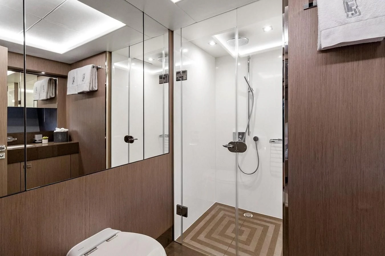 a bathroom with a shower unit aboard F5 Yacht for Sale