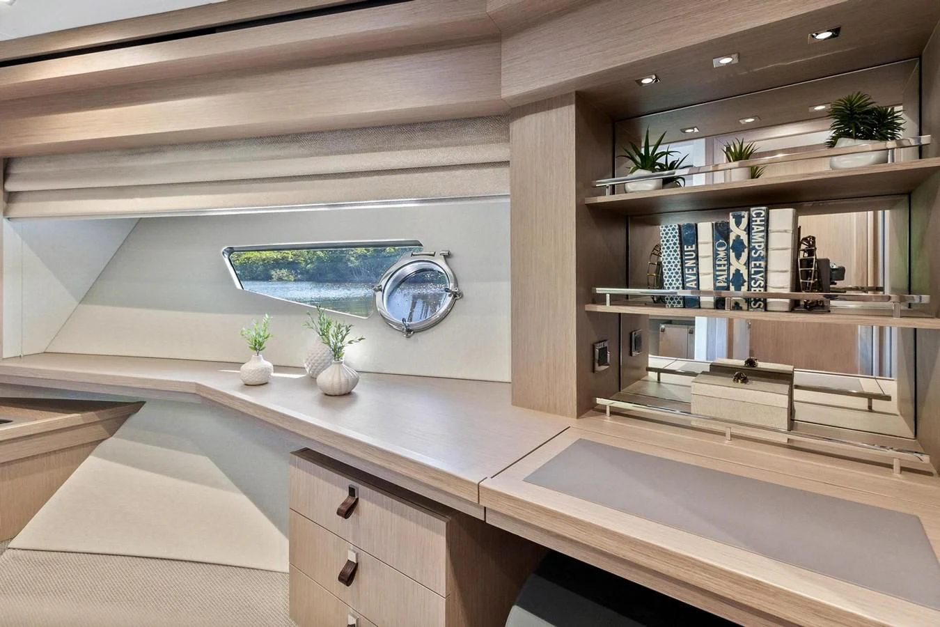 a room with a large window and a large white table with a plant on it aboard F5 Yacht for Sale