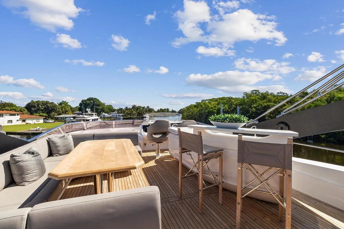 a deck with chairs and tables aboard F5 Yacht for Sale