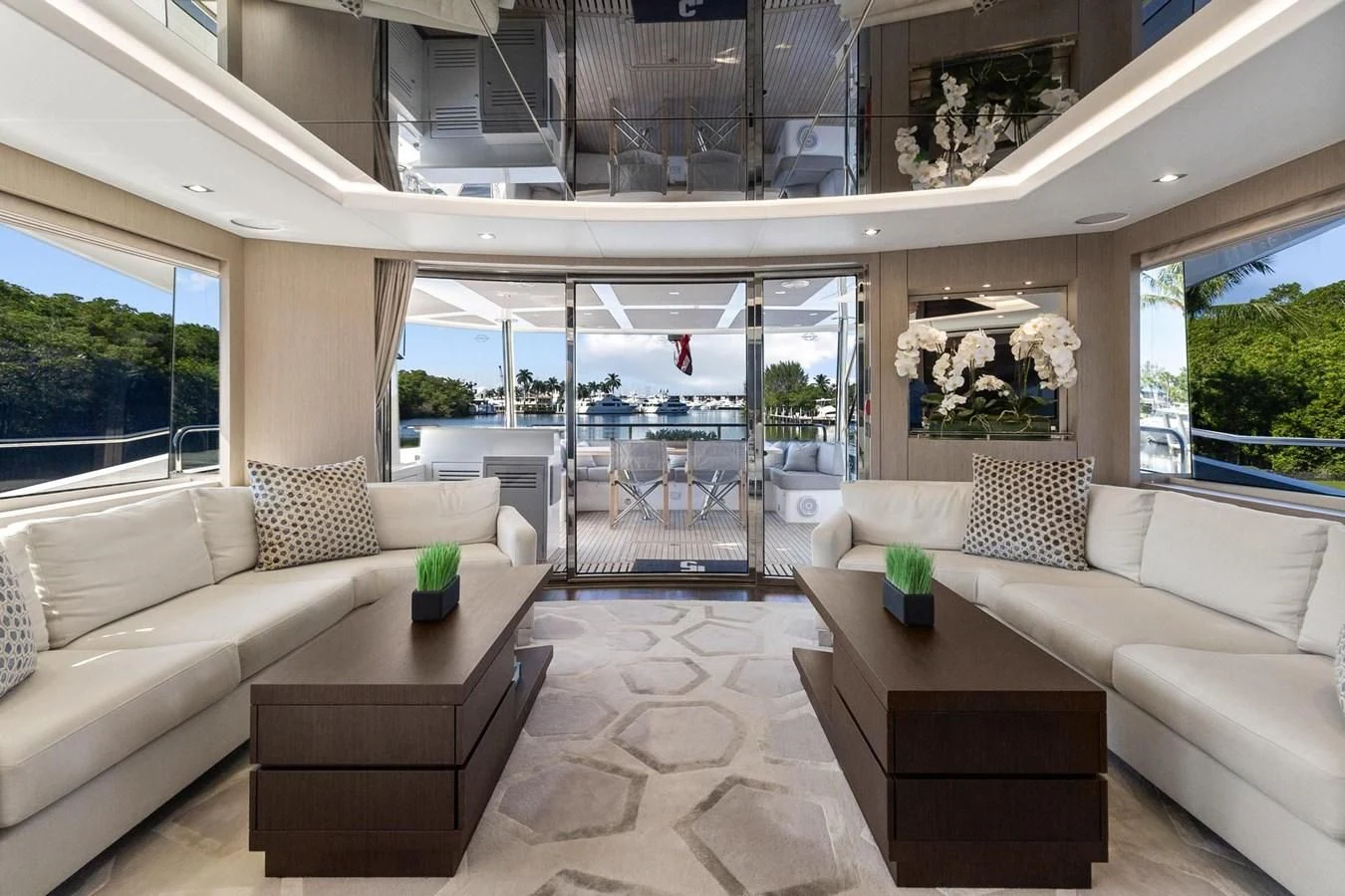 a living room with a large window aboard F5 Yacht for Sale