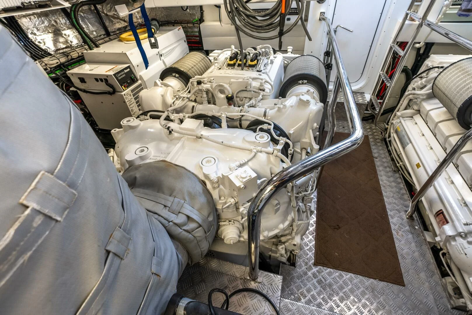 a car with a large engine aboard F5 Yacht for Sale