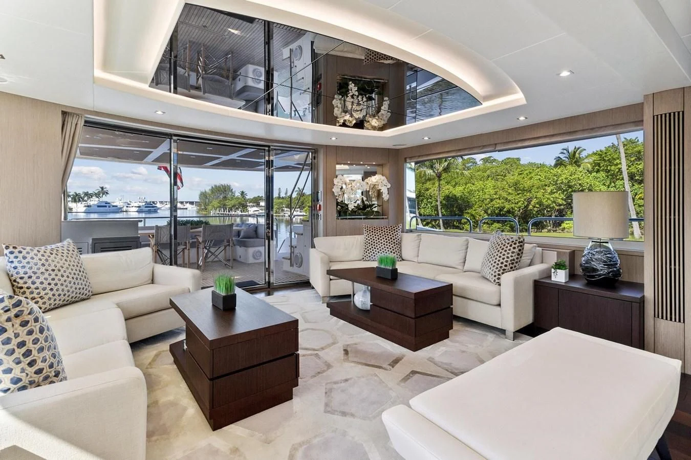 a living room with a large window aboard F5 Yacht for Sale