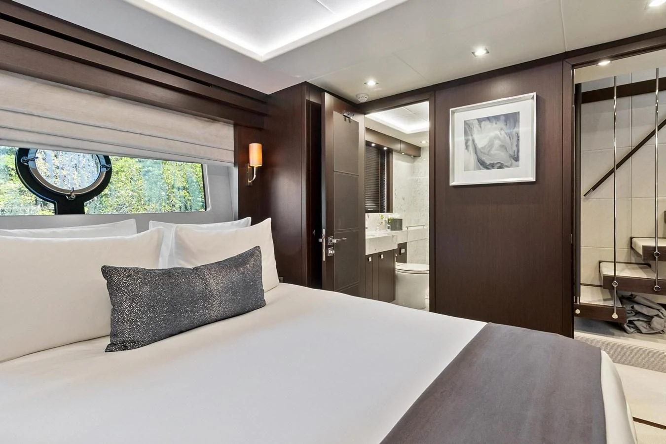 a large bed in a hotel room aboard F5 Yacht for Sale