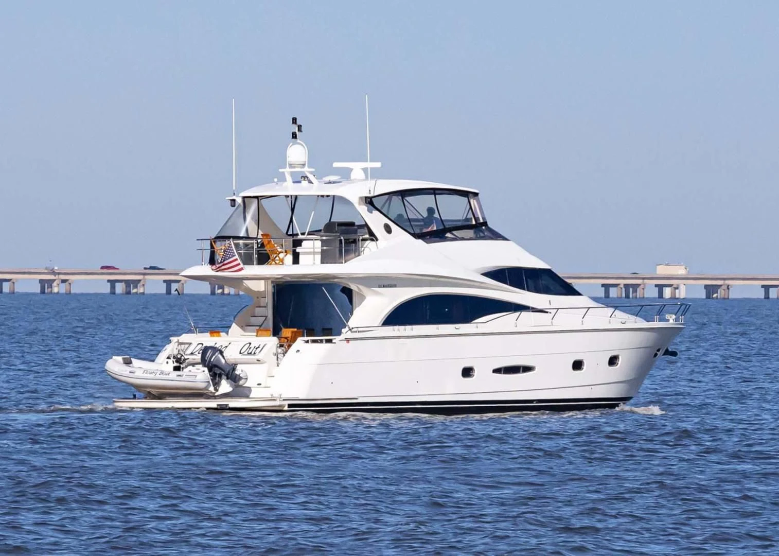 a white yacht in the water aboard DECKED OUT Yacht for Sale