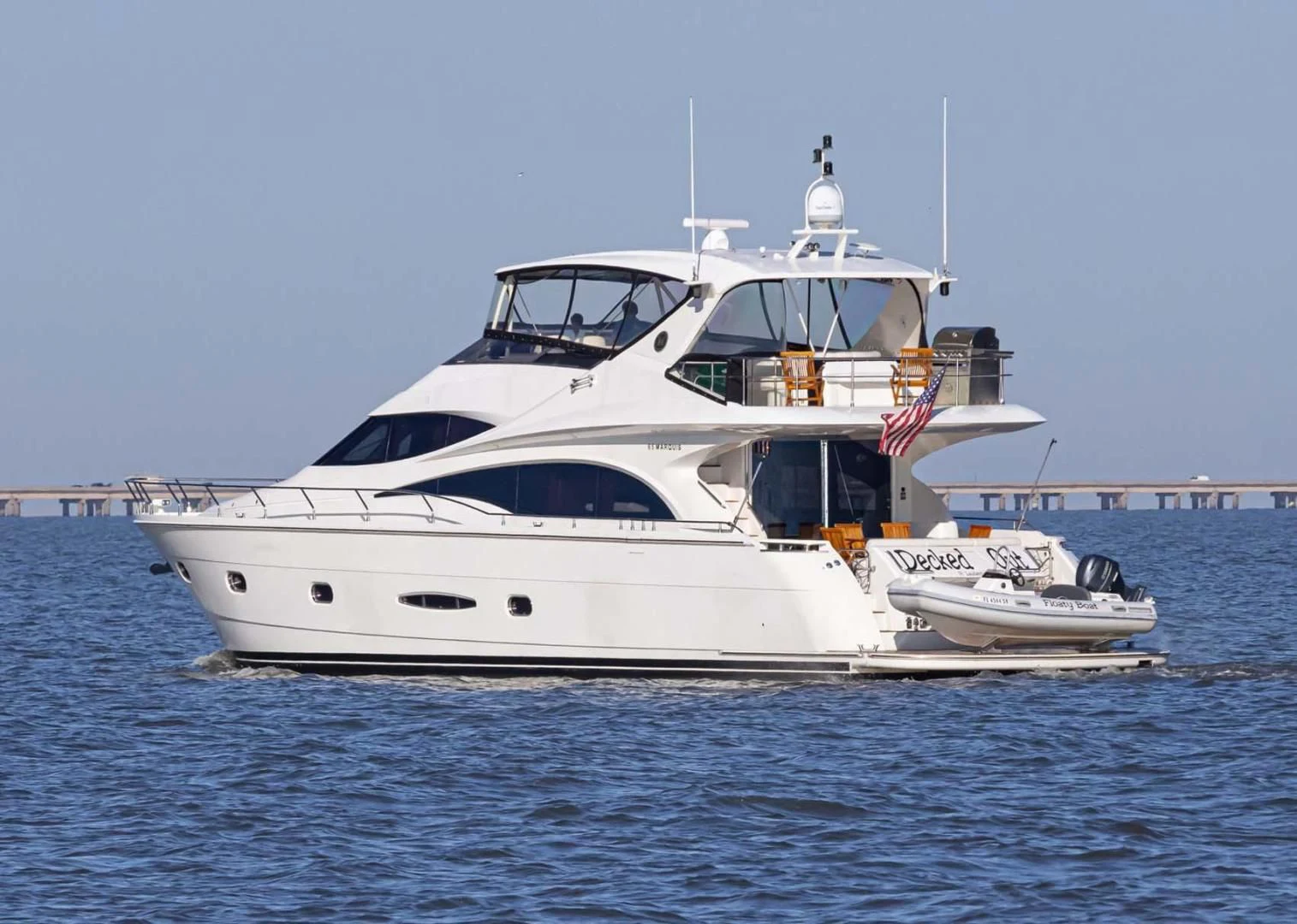 a white yacht in the water aboard DECKED OUT Yacht for Sale