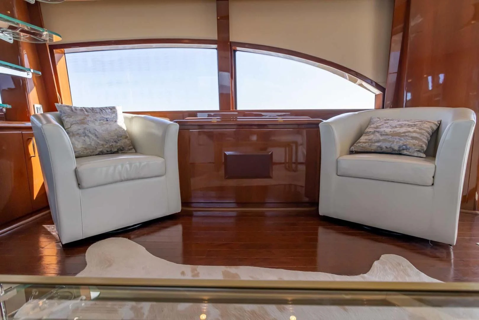 a living room with a wood floor aboard DECKED OUT Yacht for Sale