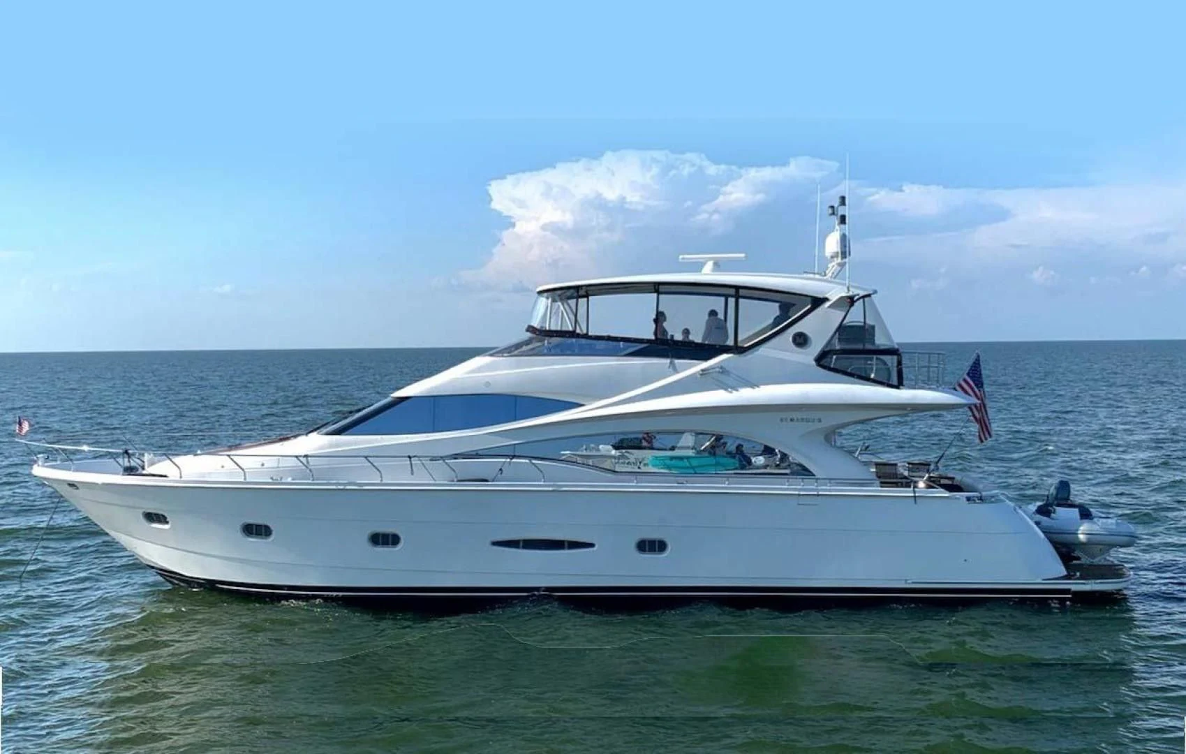 a white yacht in the water aboard DECKED OUT Yacht for Sale