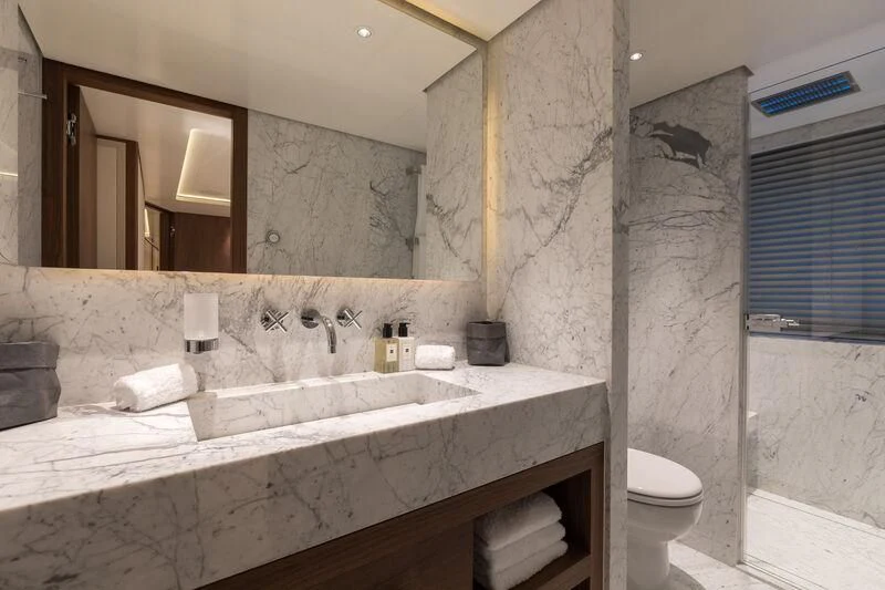 a bathroom with a large mirror aboard DELTA ONE Yacht for Charter
