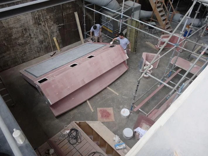 a construction site with a few men aboard DELTA ONE Yacht for Charter