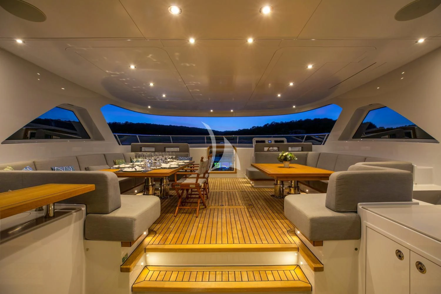 inside of a room with a swimming pool and a table and chairs aboard DELTA ONE Yacht for Charter