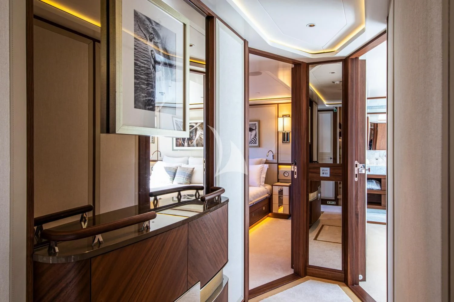 a hallway with a bed and a mirror aboard DELTA ONE Yacht for Charter
