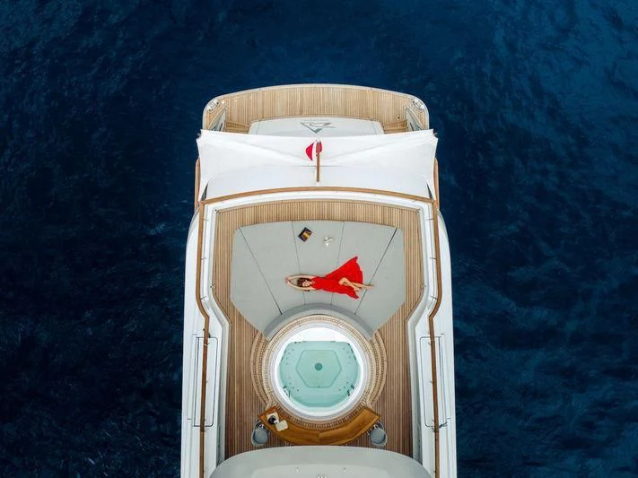 a white clock on a stand aboard DELTA ONE Yacht for Charter