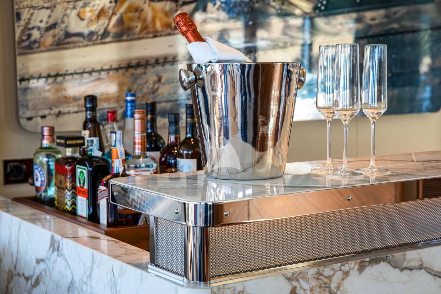 a glass of champagne on a bar aboard DELTA ONE Yacht for Charter
