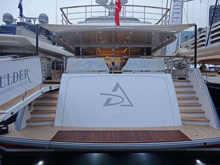 a large ship in a harbor aboard DELTA ONE Yacht for Charter