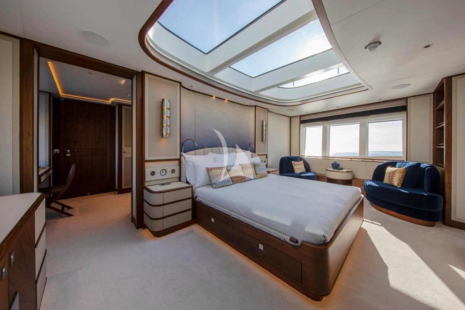 a bedroom with a bed and a couch aboard DELTA ONE Yacht for Charter