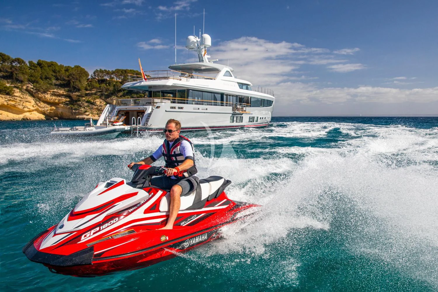 a man on a jet ski aboard DELTA ONE Yacht for Charter