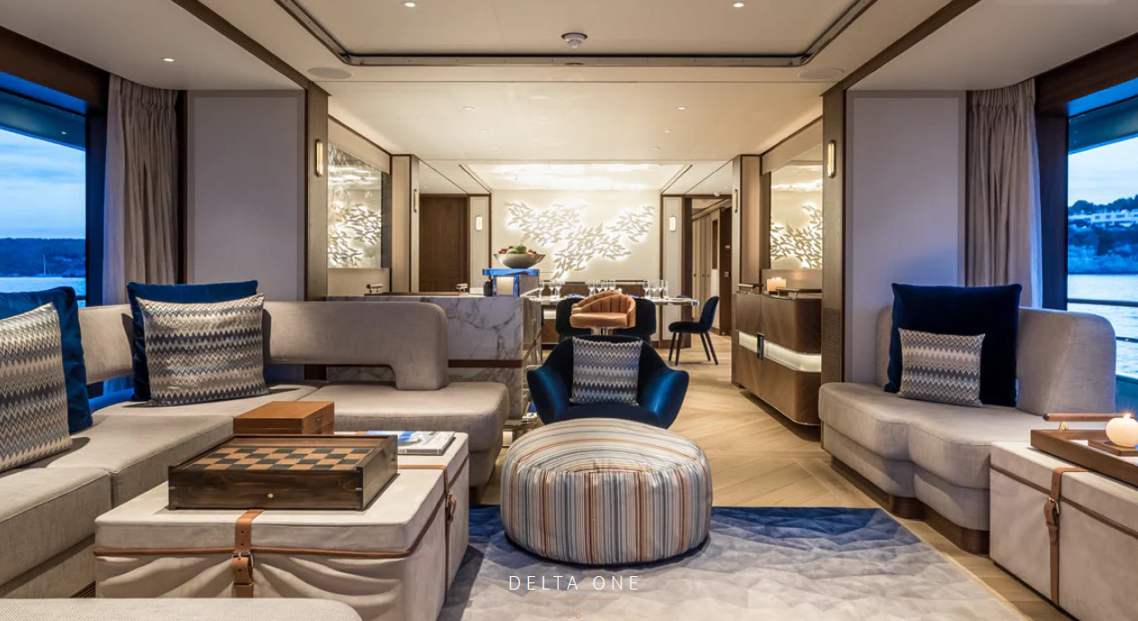 a living room with a couch and a coffee table aboard DELTA ONE Yacht for Charter