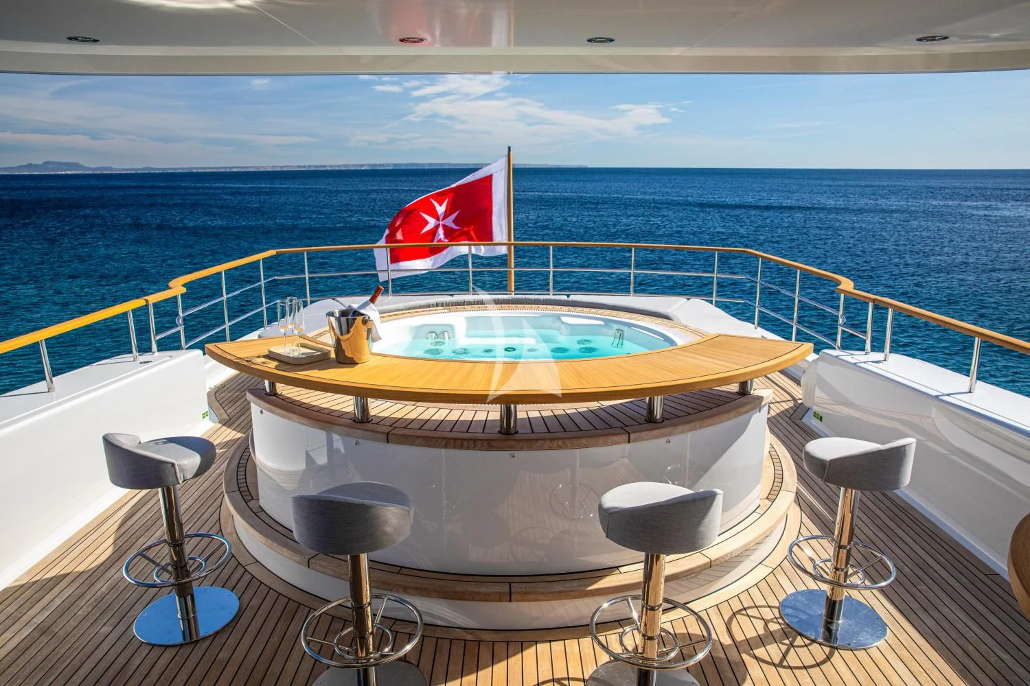 a swimming pool with a flag on the side of it aboard DELTA ONE Yacht for Charter