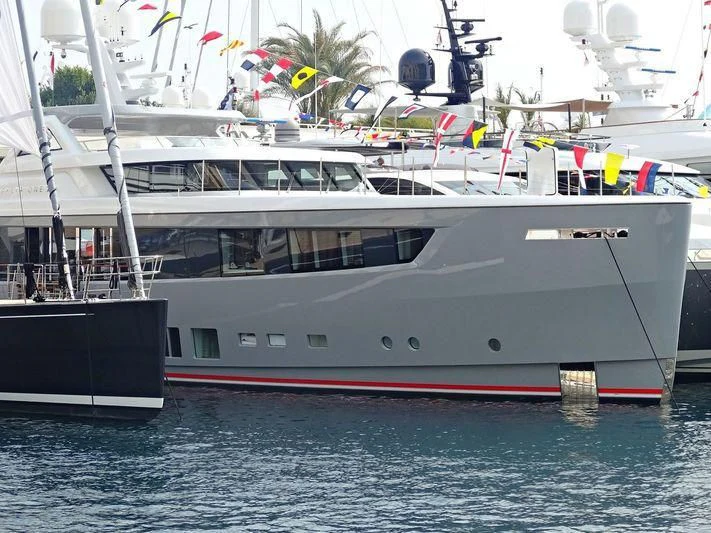 a large white boat with flags aboard DELTA ONE Yacht for Charter