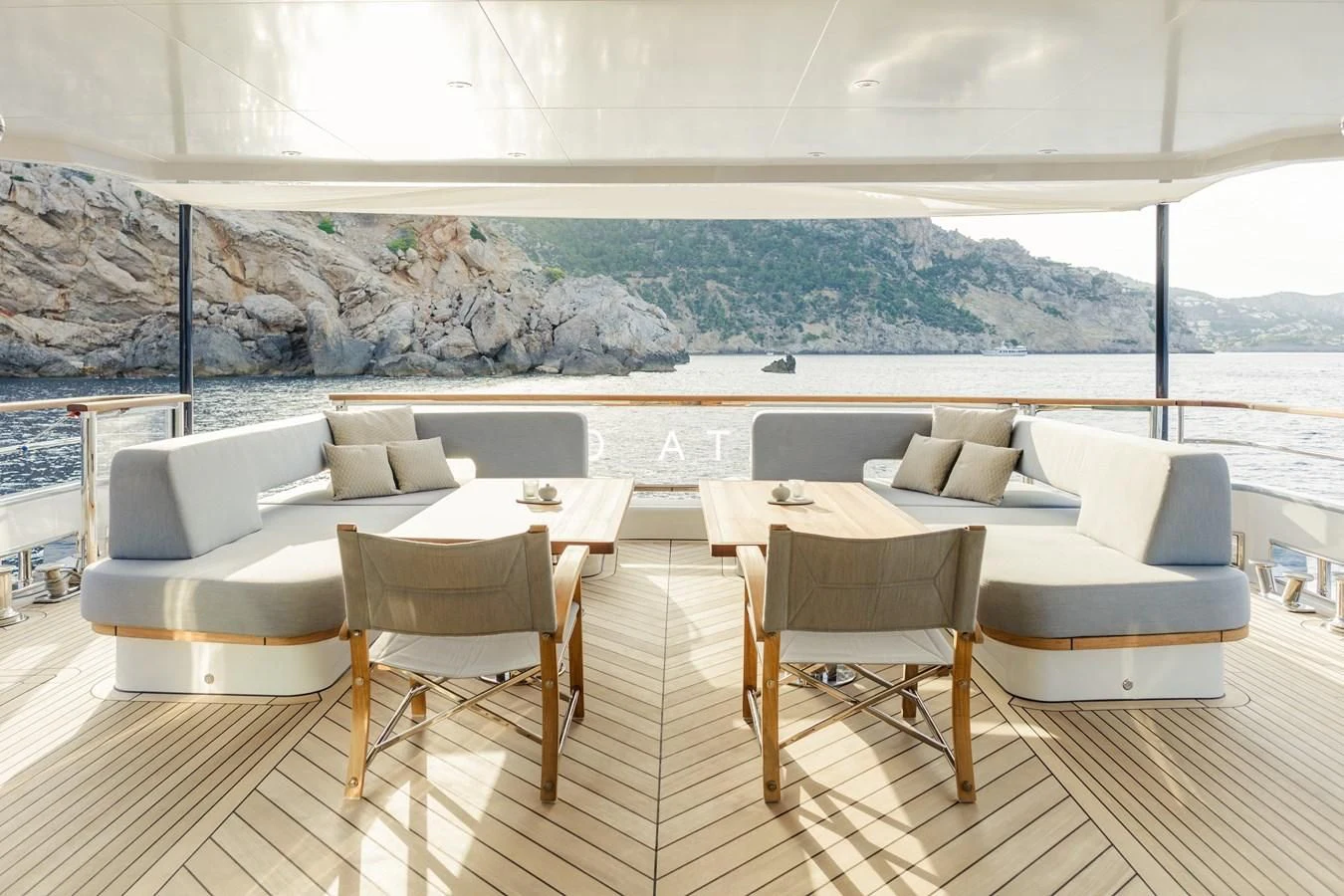 a room with a couch and chairs aboard DELTA ONE Yacht for Charter