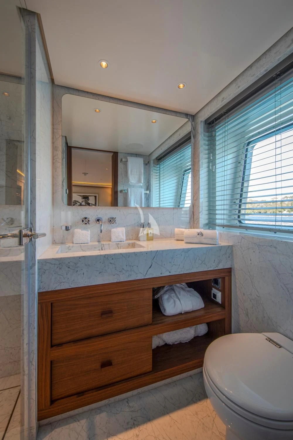 a bathroom with a sink and a mirror aboard DELTA ONE Yacht for Charter