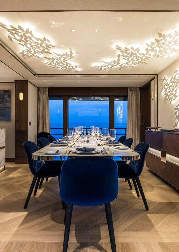 a room with a table and chairs aboard DELTA ONE Yacht for Charter
