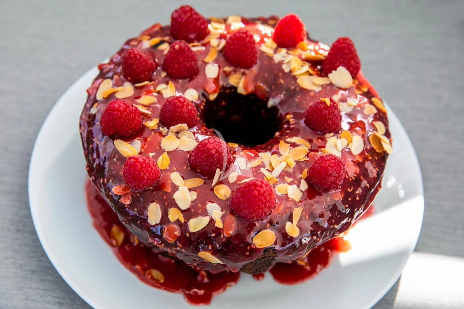 a cake with berries and nuts aboard DELTA ONE Yacht for Charter