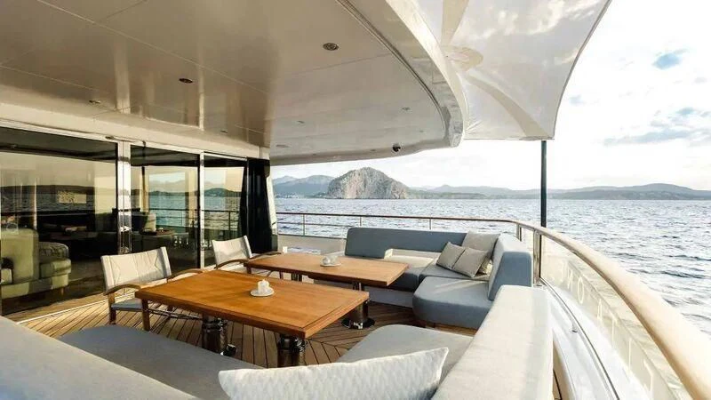 a room with a table and chairs aboard DELTA ONE Yacht for Charter