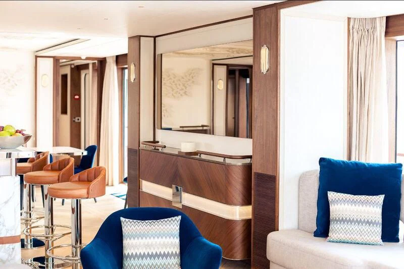 a room with a desk and chairs aboard DELTA ONE Yacht for Charter