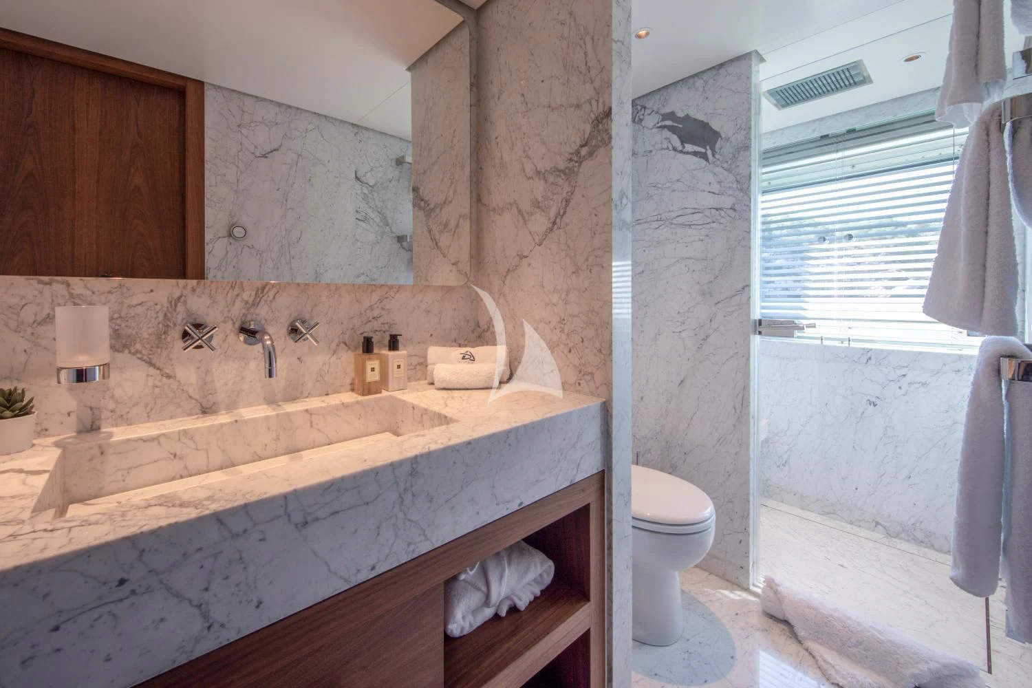 a bathroom with a sink and a toilet aboard DELTA ONE Yacht for Charter