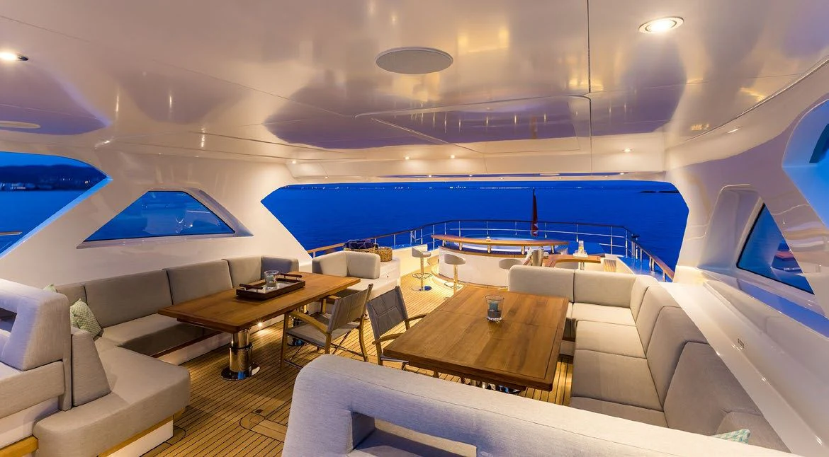 a room with a table and chairs aboard DELTA ONE Yacht for Charter